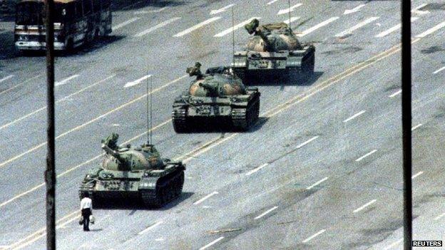 A Beijing citizen stands in front of tanks on the Avenue of Eternal Peace in this 5 June 1989 file photo during the crushing of the Tiananmen Square uprising