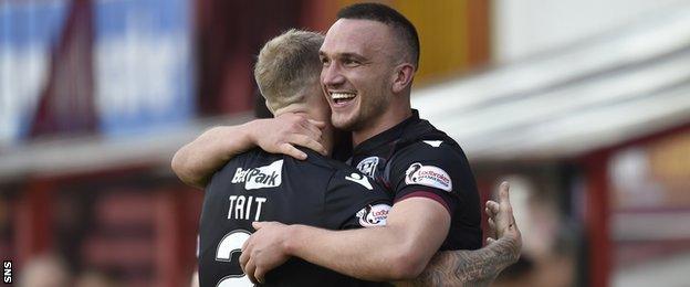 Tom Aldred celebrates with Motherwell team-mate Richard Tait