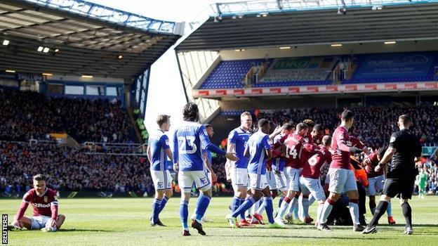 Aston Villa midfielder Jack Grealish sits on the ground following the attack