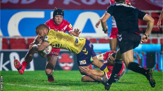 Wigan's Tommy Leuluai scores a try