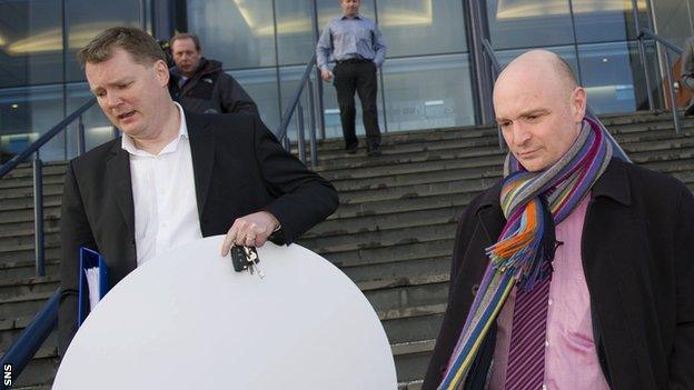 Dundee Utd Chairman Stephen Thompson (right) leaves Hampden after a lengthy SPL meeting