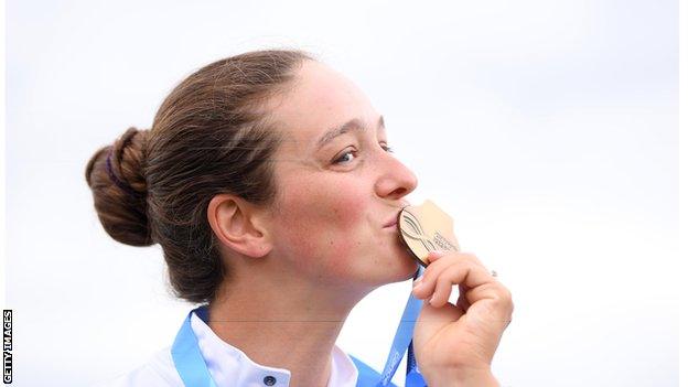 Mallory Franklin kisses a medal