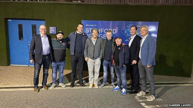 Todd Boehly with George Osborne and fans outside Stamford Bridge