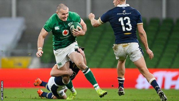 Ireland's Jacob Stockdale runs with the ball against Scotland