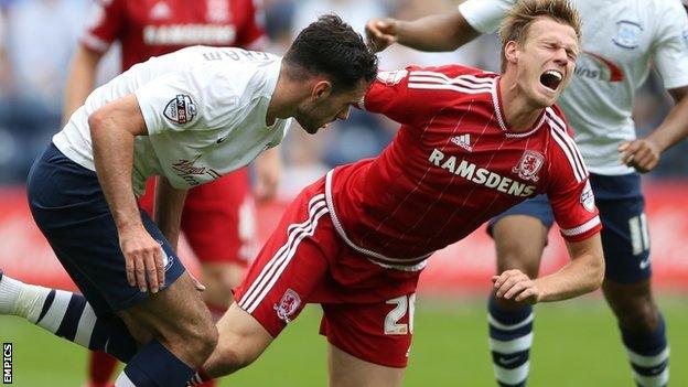 Preston North End's Greg Cunningham (l) tackles Middlesbrough's Tomas Kalas (right)