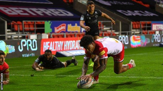 St Helen's Kevin Naiqama scores against Catalans