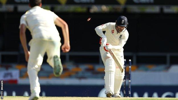 Mark Stoneman is bowled by Pat Cummins