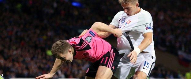 Scotland's James Forrest gets to grips with Slovakia's Tomas Hubocan