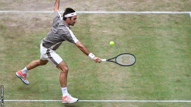 Federer hits a backhand