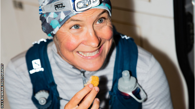 Andrea Mason tucks into chicken nuggets after completing her challenge