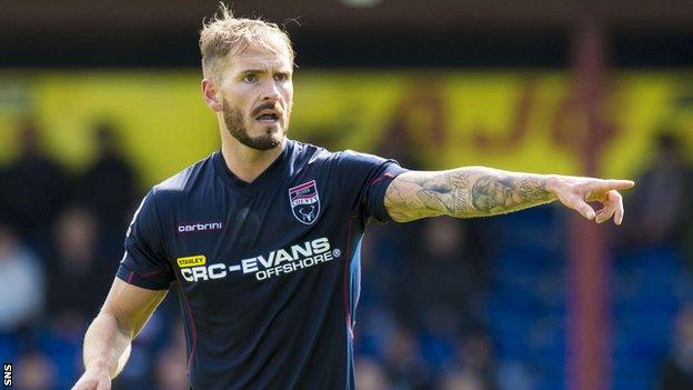 Martin Woods in action for Ross County