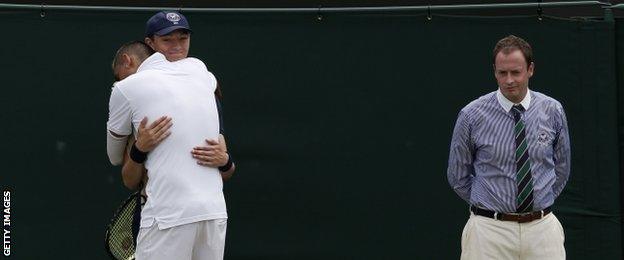 Nick Kyrgios hugs a ball boy