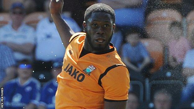 John Akinde heads a goal for Barnet