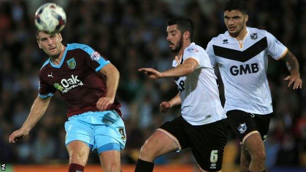 Sam Vokes shoots at goal past Richard Duffy