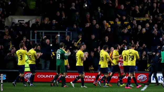 Oxford United players celebrate reaching the JPT final