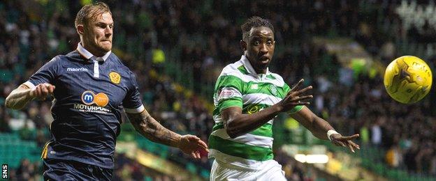 Moussa Dembele races for the ball with Motherwell's Richard Tait