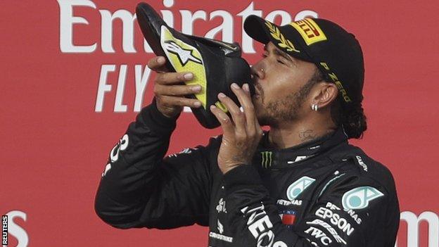 Lewis Hamilton does a shoey