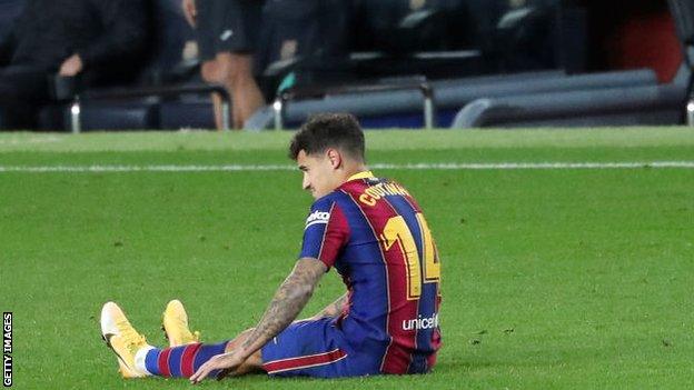 Philippe Coutinho sits on the pitch after picking up an injury against Eibar