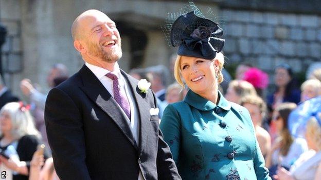 Former England rugby union player Mike Tindall shares a joke with wife Zara