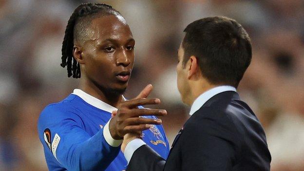 Joe Aribo shakes Van Bronckhorst's hand