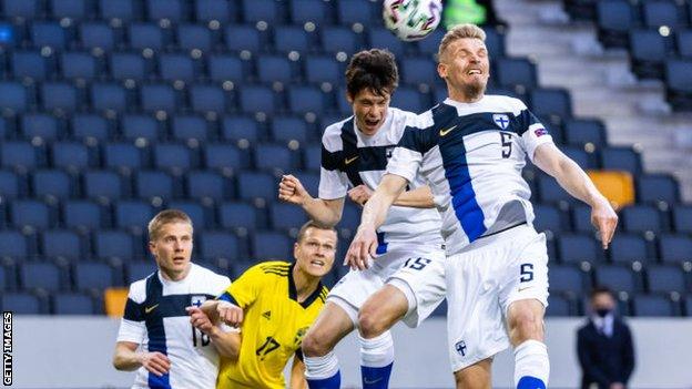 Juhani Ojalac, right, earned his most recent Finland cap against Sweden earlier this year