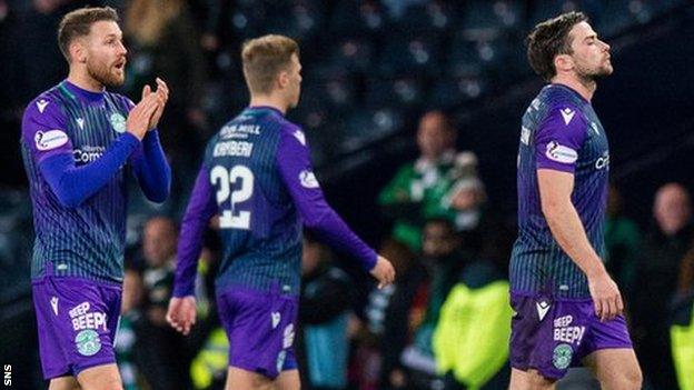 Hibs players trudge of the Hampden pitch