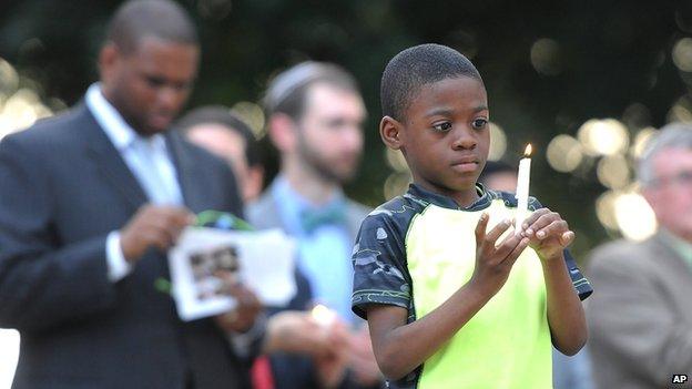 Boy holding a candle