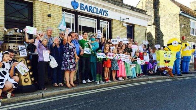 Protestors gather outside Barclays Bank in Littleport