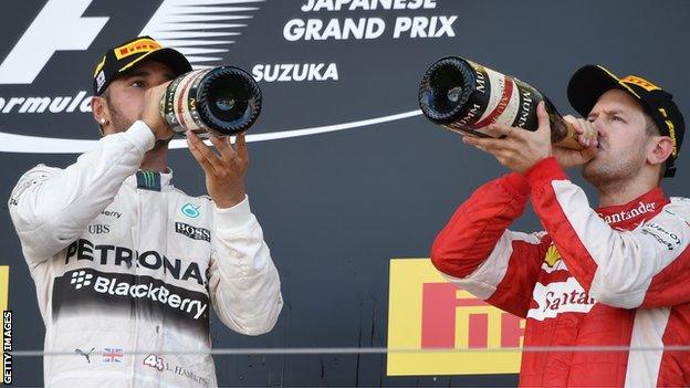 Mercedes AMG F1 driver Lewis Hamilton and Ferrari F1 driver Sebastian Vettel on the podium at the 2015 Japanese Grand Prix