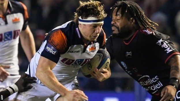 Hamish Watson takes on Toulon centre Mathieu Bastareaud