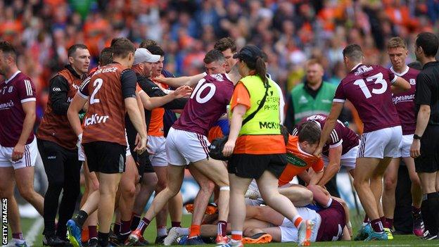 Both sets of players brawl at full-time