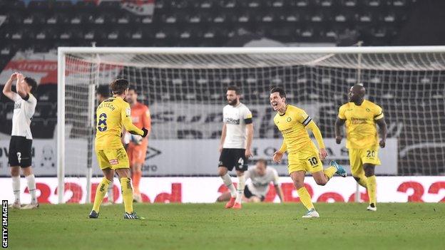 Matt Bloomfield celebrates his equaliser for Wycombe against Derby