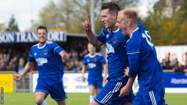 Jamie Masson celebrates with teammate Jordon Brown (right) after making it 4-0