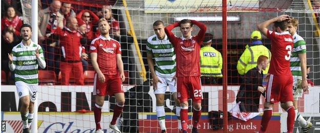 James Maddison holds his head in his hands after missing a late chance for Aberdeen