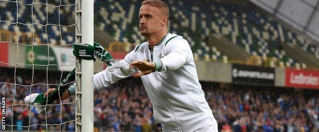 Leigh Griffiths tied a Celtic scarf to the goal posts at full time in Belfast