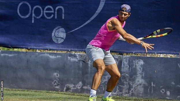 Rafael Nadal prepares to hit a forehand