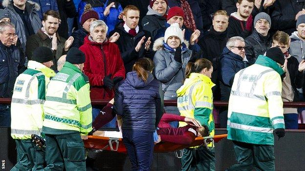 Hearts defender Callum Paterson is carried off on a stretcher