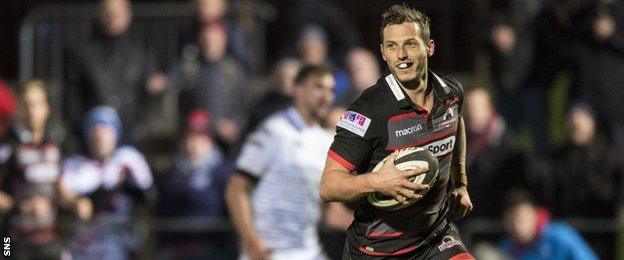 Edinburgh's Jason Tovey scores a try