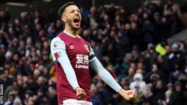 Dwight McNeil celebrates scoring for Burnley