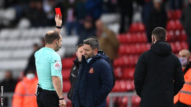 Lee Johnson (centre) was sent off by referee Jeremy Simpson in the 95th minute of Sunderland's defeat by Lincoln in January