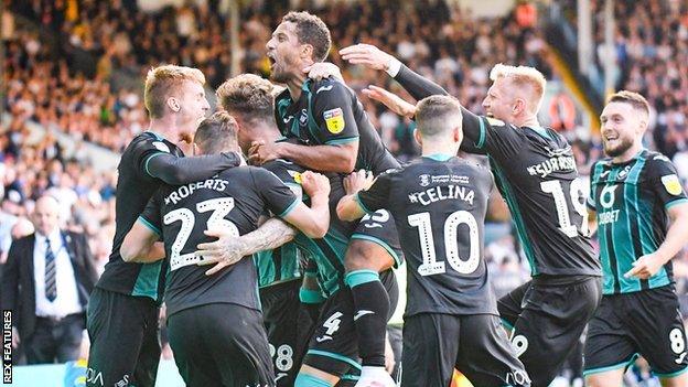 Swansea City players celebrate