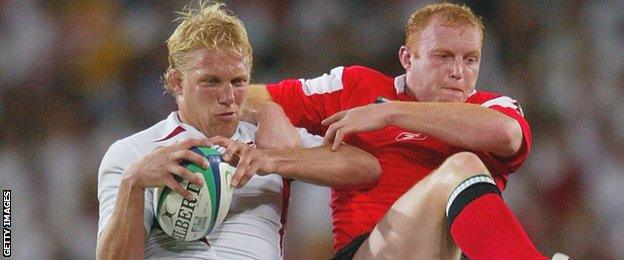 England's Lewis Moody wins a line-out ahead of Wales' Martyn Williams during their 2003 World Cup quarter-final