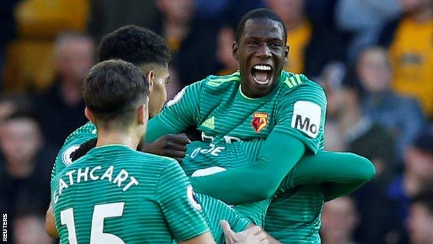 Abdoulaye Doucoure celebrates one of Watford's goals at Wolves on Saturday