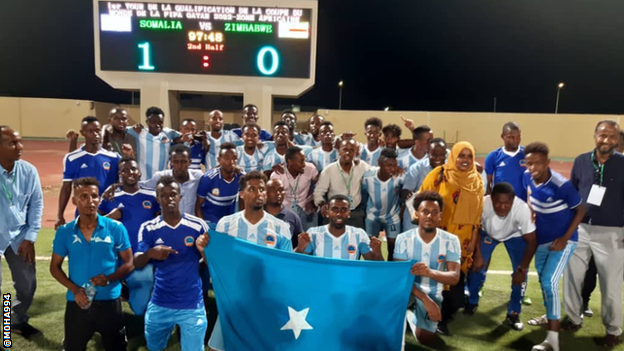 Somalia players pose for a photo following their victory against Zimbabwe