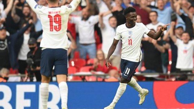 Bukayo Saka celebrates scoring for England against Andorra in a World Cup qualifying match