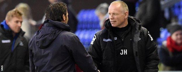 Dundee's Paul Hartley and Caley Thistle's John Hughes shake hands