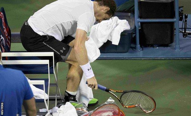 Andy Murray smashes his racquet