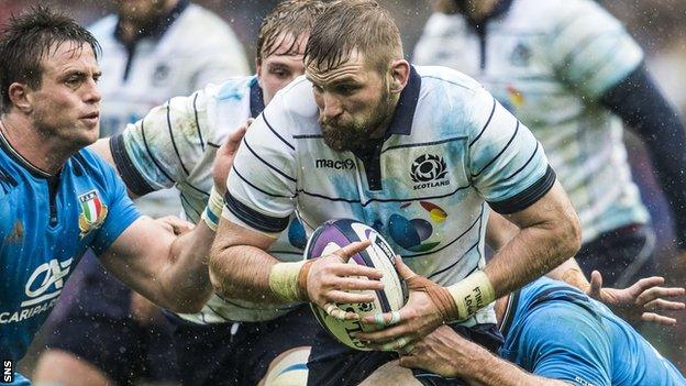 John Barclay carries the ball for Scotland against Italy