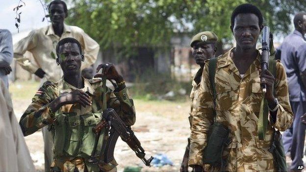 In this photo taken Wednesday, 24 June 2015, South Sudanese government soldiers patrol in Bentiu town, South Sudan