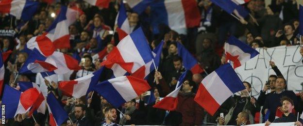 France fans show their support during the first half